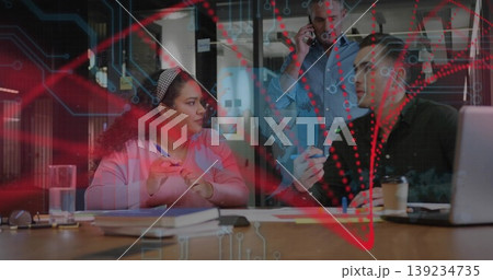 Collaborating business team discussing plans in boardroom, with table notebooks laptop smartphone 139234735