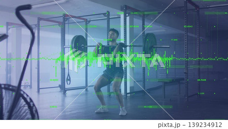 Squatting man performing loaded barbell exercise at gym rack, with digital overlay Squatting man performing loaded barbell exercise at gym rack, with digital overlay 139234912