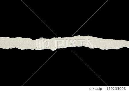 Ripped torn paper edges isolated on black background Ripped torn paper edges isolated on black background 139235008