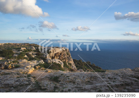 Scenic view of the rugged Dingli Cliffs and the Mediterranean Sea in Malta Scenic view of the rugged Dingli Cliffs and the Mediterranean Sea in Malta 139235090