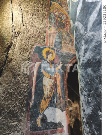 Ancient Byzantine frescoes and religious murals inside Gumusler Monastery in Turkey 139235180