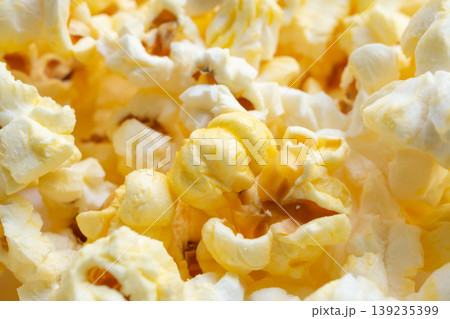 Tasty popcorn close up background top view Tasty popcorn close up background top view 139235399