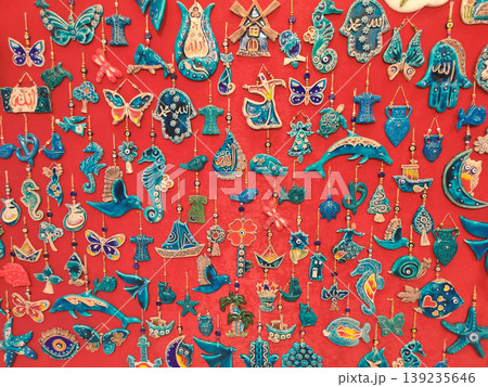 Colorful Turkish ceramic souvenirs and amulets on a red background 139235646