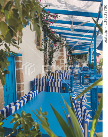 Traditional blue and white Greek tavern terrace in Rhodes 139235700