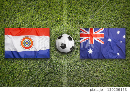 Paraguay vs. Australia flags on a soccer field Paraguay vs. Australia flags on a soccer field 139236158
