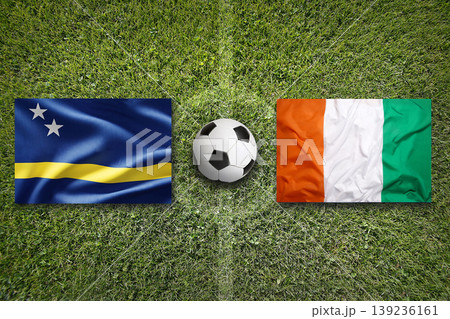 Curacao vs. Ivory Coast flags on a soccer field 139236161