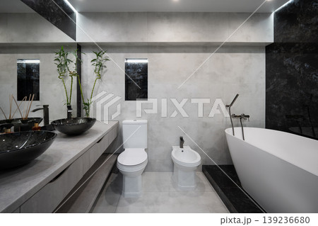 Modern minimalist bathroom with stone textures and luxury fixtures 139236680
