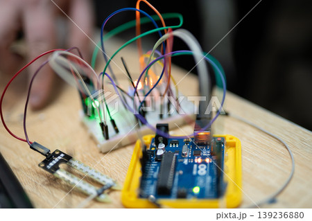an engineer is engaged in the development and layout of electrical circuits 139236880