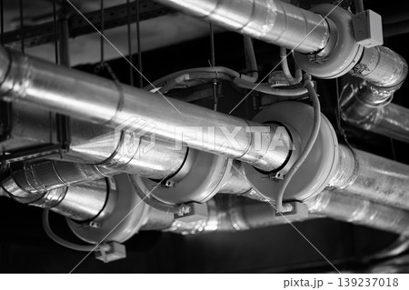 Black and white close-up of industrial ventilation system pipes 139237018
