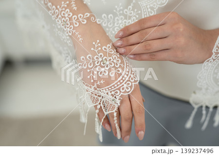 wedding veil close-up of embroidered pattern on hand 139237496