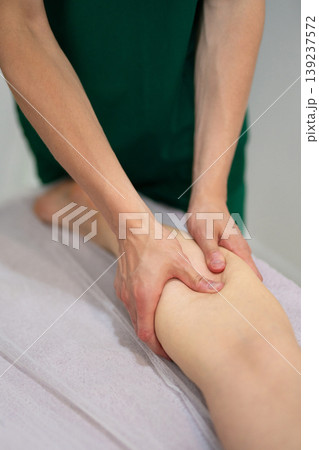 Professional leg massage treatment in wellness spa center 139237572