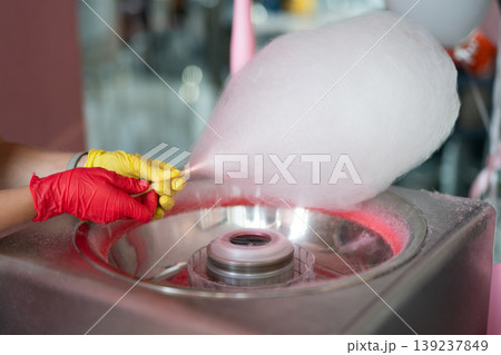 Making cotton candy at a festive event 139237849