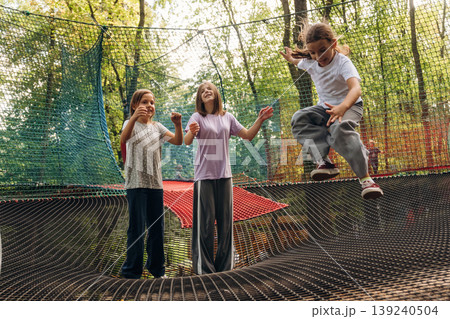 Weekend activities, fun. Kids are playing on the children's amusement ropes course 139240504