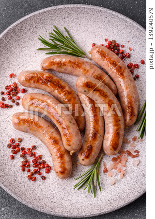 Grilled pork or chicken sausages, smoked fried food with salt and spices. Grilled sausages 139240579