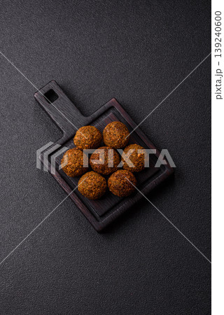 Falafel, a hearty Arabic dish made from boiled chickpeas for vegetarians. Chickpea falafel Falafel, a hearty Arabic dish made from boiled chickpeas for vegetarians. Chickpea falafel 139240600