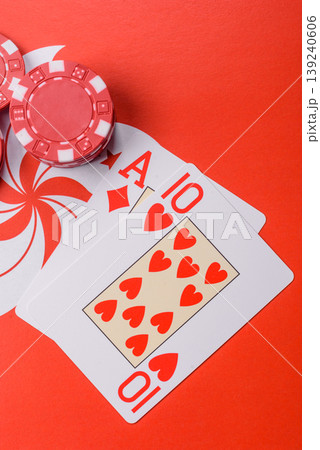 Playing cards and chips on a table, a gambling game of blackjack or baccarat. Cards and chips Playing cards and chips on a table, a gambling game of blackjack or baccarat. Cards and chips 139240606