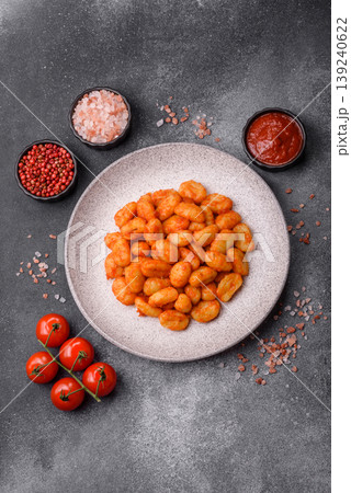 Homemade potato gnocchi with Bolognese sauce, seasoned with salt and spices. Gnocchi with sauce Homemade potato gnocchi with Bolognese sauce, seasoned with salt and spices. Gnocchi with sauce 139240622