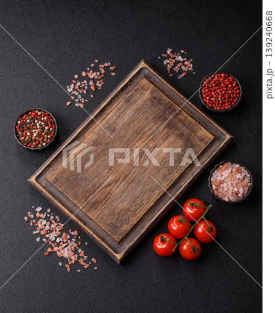 An empty wooden cutting board, kitchen utensils for food preparation. An empty cutting board 139240668