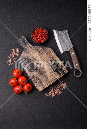 An empty wooden cutting board, kitchen utensils for food preparation. An empty cutting board An empty wooden cutting board, kitchen utensils for food preparation. An empty cutting board 139240670