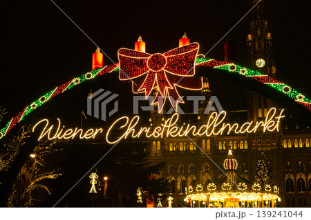 Wiener Christkindlmarkt neon sign with festive red bow. Beautiful Christmas Card in Vienna. 139241044