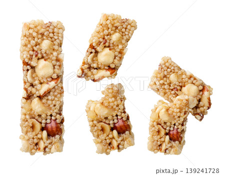 Set of cereal bars with nuts and a broken cut out on a white background. Top view Set of cereal bars with nuts and a broken cut out on a white background. Top view 139241728