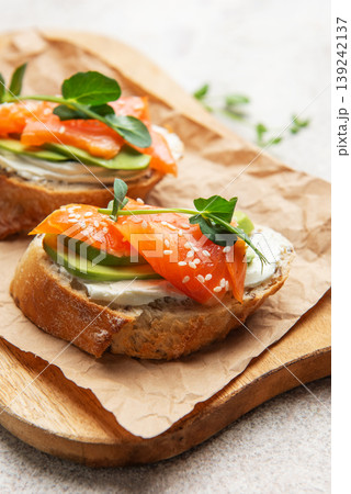 Salmon avocado toast with cream cheese and greens 139242137