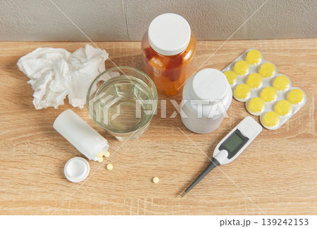 Cold and flu healing with medicine and thermometer Cold and flu healing with medicine and thermometer 139242153
