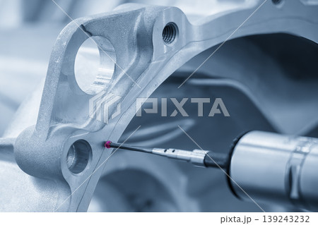 Advanced multi-axis CMM machine measuring precision dimensions of an automatic gear housing part. 139243232