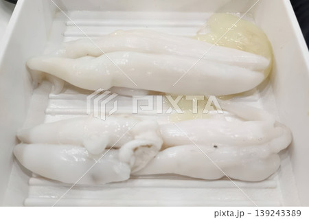 Fresh Raw Cuttlefish Roe and Sperm Sacs in a White Tray for Sushi Preparation 139243389