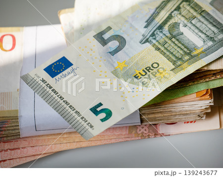 Five euro banknote stack on table. Paper currency and cash money pile. Financial wealth, business saving and banking economy concept. European bank note for commerce and investment. 139243677