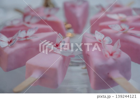Ice cream shape. Detailed close up view of bunch of delicious sweets, celebration event Ice cream shape. Detailed close up view of bunch of delicious sweets, celebration event 139244121