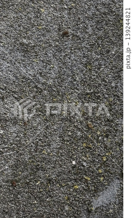 Textured Asphalt Surface with Natural Elements 139244821
