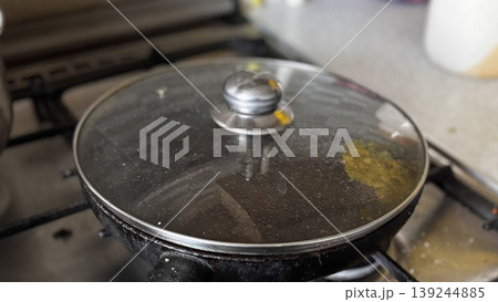 Cooking with Care A Covered Pan on the Stove Cooking with Care A Covered Pan on the Stove 139244885