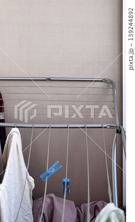 Indoor Laundry Drying Rack with Clothes Hanging Indoor Laundry Drying Rack with Clothes Hanging 139244892