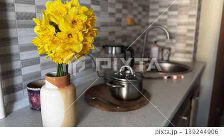 Bright Yellow Daffodils in a Modern Kitchen Setting Bright Yellow Daffodils in a Modern Kitchen Setting 139244906