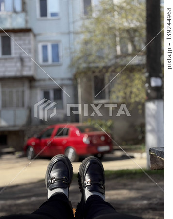 Relaxing Afternoon in Urban Setting with Stylish Footwear Relaxing Afternoon in Urban Setting with Stylish Footwear 139244968
