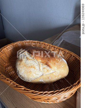 Freshly Baked Artisan Bread in a Woven Basket Freshly Baked Artisan Bread in a Woven Basket 139244969