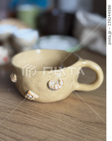 Unique Handmade Ceramic Cup with Decorative Elements 139244986