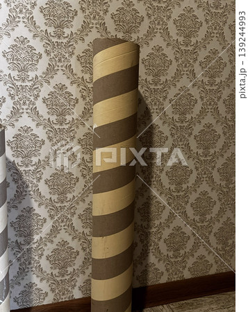 Decorative Paper Roll Display Against Elegant Wallpaper Background 139244993