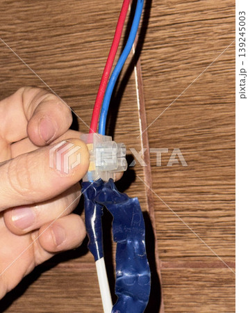 Hand Connecting Electrical Wires with Insulation Tape Hand Connecting Electrical Wires with Insulation Tape 139245003
