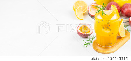 Fresh tropical passion fruit lemonade cocktail with ice and copy space for summer advertising banner 139245515