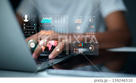 Businessman using laptop with virtual data analytics icons, world map and financial charts. Professional male hands typing for global business strategy and big data concept. Businessman using laptop with virtual data analytics icons, world map and financial charts. Professional male hands typing for global business strategy and big data concept. 139246510
