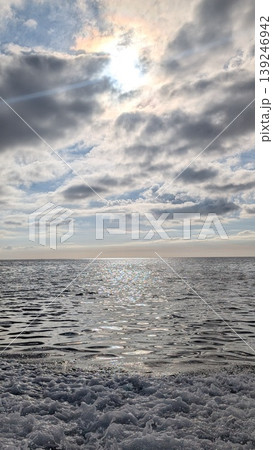 Beautiful seascape with sunlight and sky reflected in the water Beautiful seascape with sunlight and sky reflected in the water 139246942