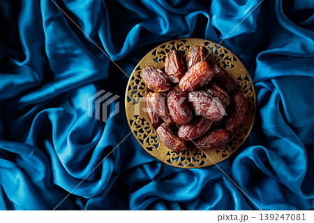 Dates on a golden platter. 139247081