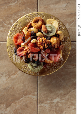 Assortment of dried tropical fruits, nuts and raisins. 139247084