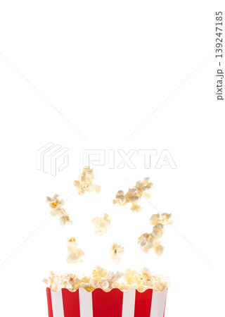 Popcorn flying out from white striped paper box isolated on white background 139247185