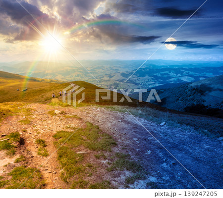 day meet night. summer landscape. mountain path through the grassy slope uphill to the sky. epic view. sun and moon over hiking trail path through borzhava ridge. ukraine mountains harmony concept day meet night. summer landscape. mountain path through the grassy slope uphill to the sky. epic view. sun and moon over hiking trail path through borzhava ridge. ukraine mountains harmony concept 139247205