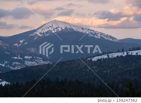 Winter evening sunset mountains (Ukraine, Carpathians -  mountain peak Khomyak scenery view from Yablunytsia Pass). 139247362