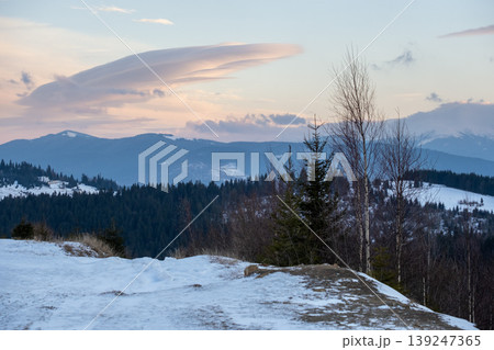 Winter evening sunset mountains (Ukraine, Carpathians -  mountain peaks scenery view from Yablunytsia Pass). 139247365