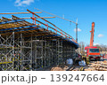 Overpass bridge construction with scaffolding and mobile crane at large infrastructure project site 139247664